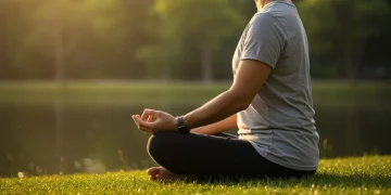 Adult meditating peacefully outdoors, symbolizing anxiety reduction through mindful practice